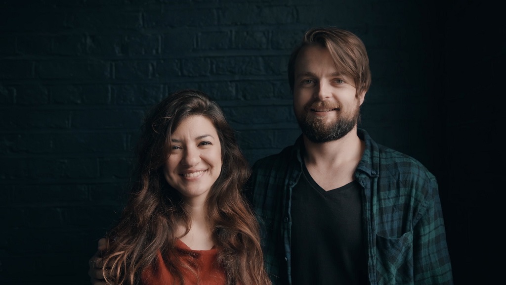 A man and a woman standing next to each other in a photo