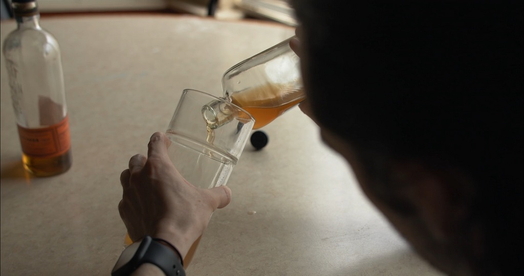 Pouring whiskey into a glass